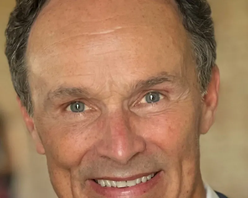 Dr. William Neff, DDS, smiling, in a portrait from 2024.